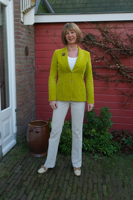 Lime green corduroy jacket and cream corduroy trousers