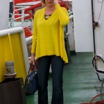 Flared jeans with yellow sweater