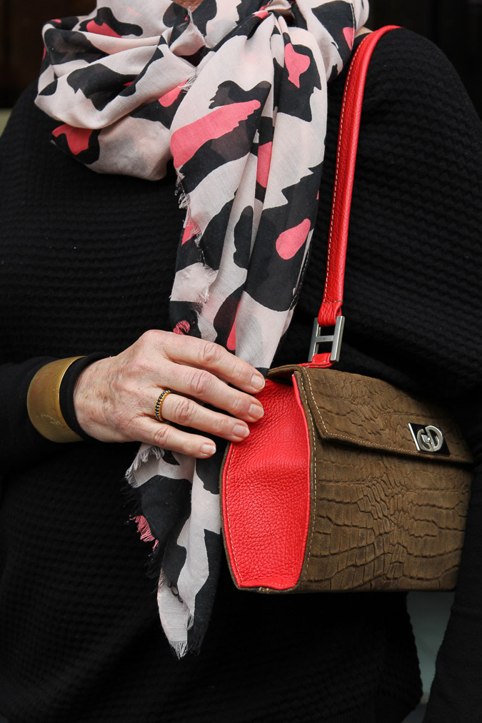 Pink, black and white scarf and a Marck&Co bag