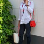 Eijk flat shoes and a red mini bag