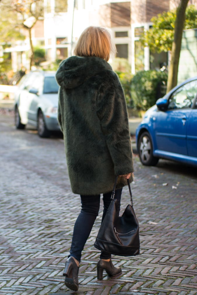 Red sweater and a green faux fur coat