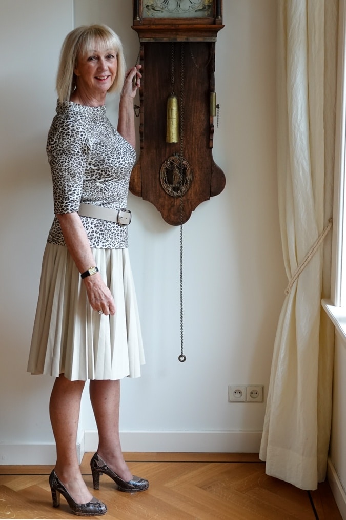 Leopard print top with cream pleated skirt