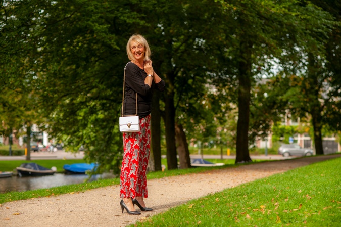 Red trousers with tigers and black top