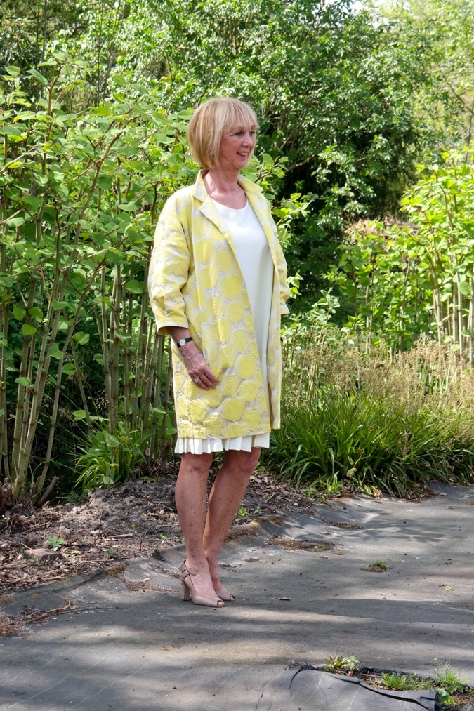 Yellow sleeveless dress with yellow jacket
