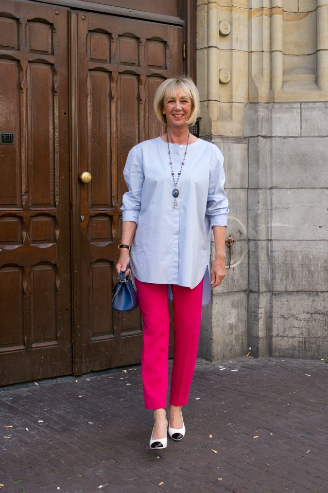 Bright pink trousers with baby blue shirt