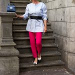 A pair of bright pink trousers, worn three ways