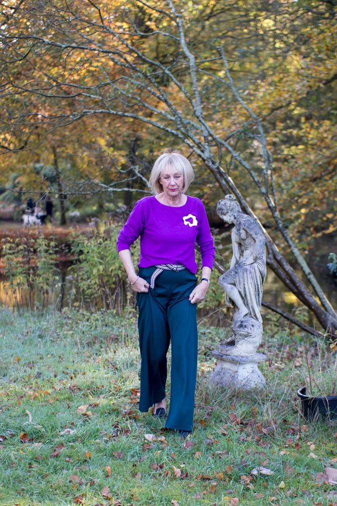 Wide green trousers with purple jumper