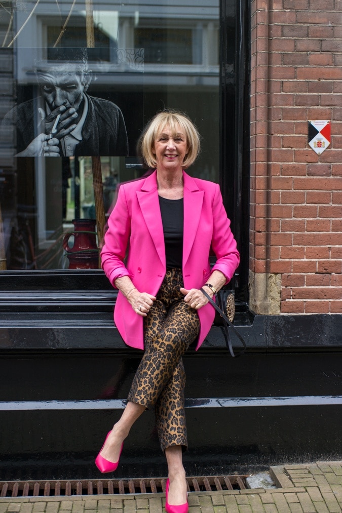bright pink jacket with leopard trousers