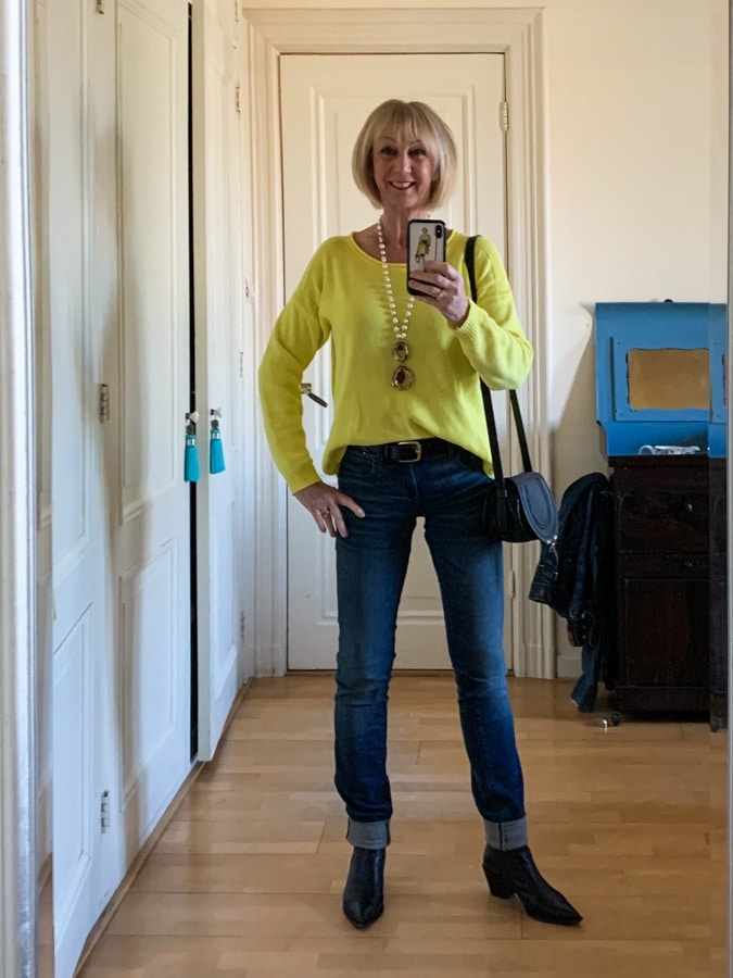 Bright yellow jumper on jeans