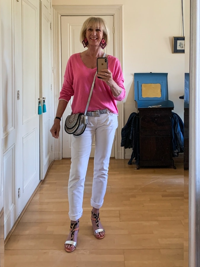 Bright pink jumper on white jeans