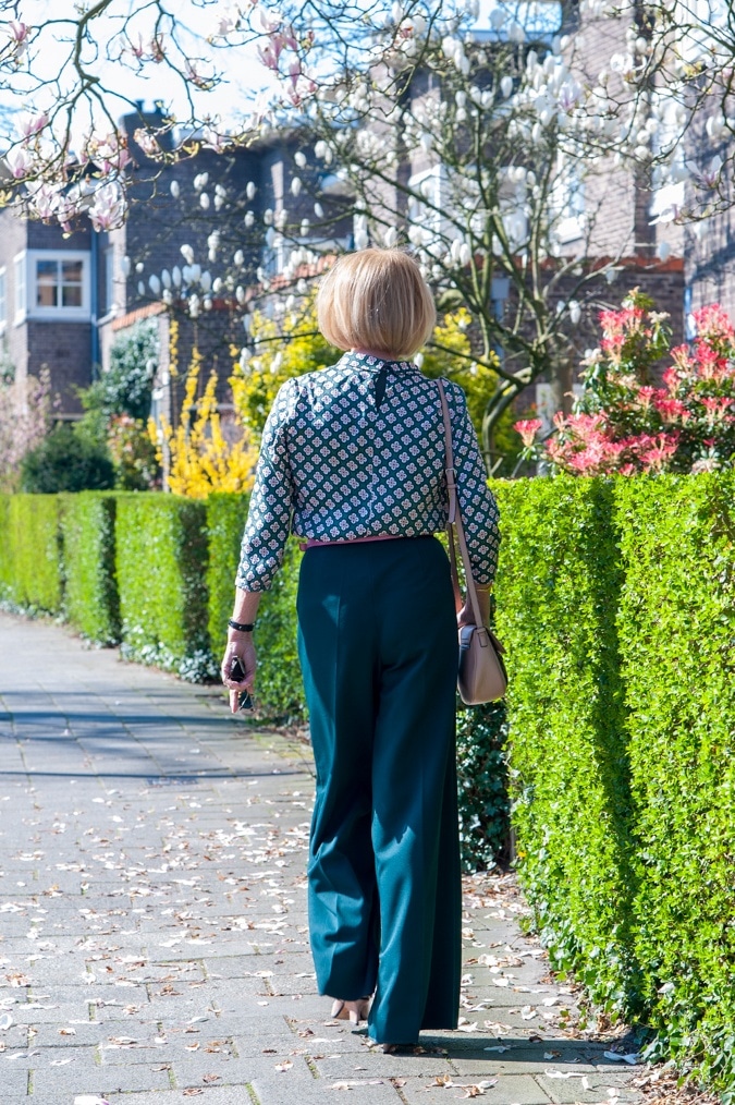 Pink and green blouse on green wide trousers