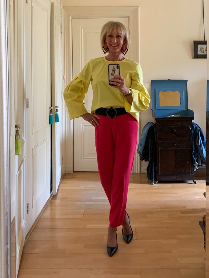 Bright yellow top with bright pink trousers