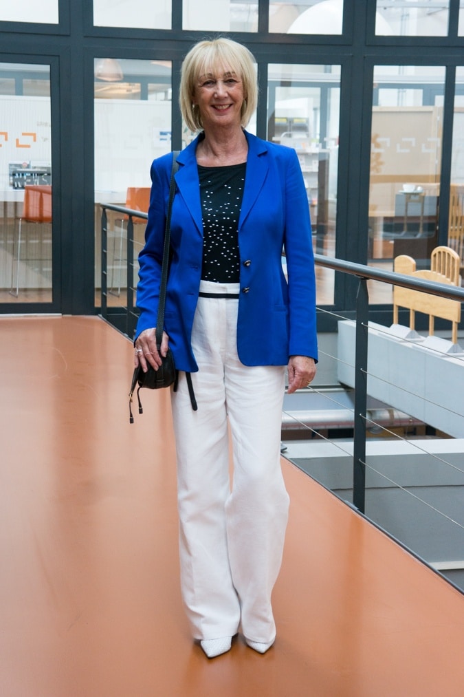 Bright blue jacket with white trousers