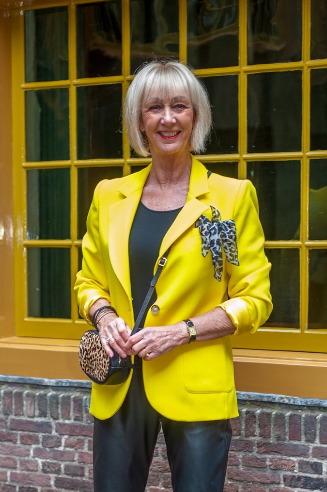 Yellow jacket with black leather trousers