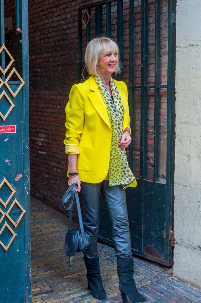 Yellow jacket with black leather trousers