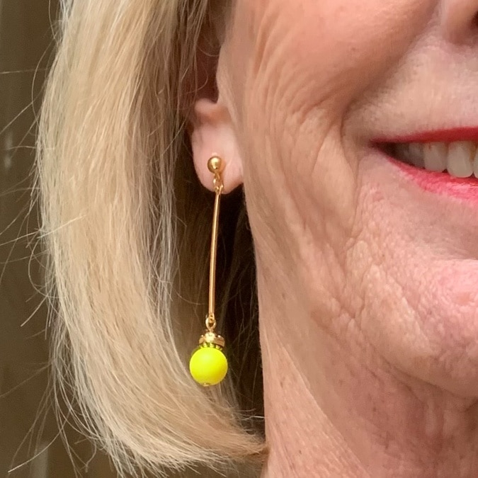 close-up neon yellow earring