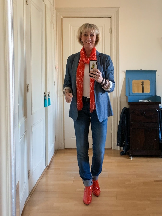 Denim jacket with orange/white scarf and orange ankle boots