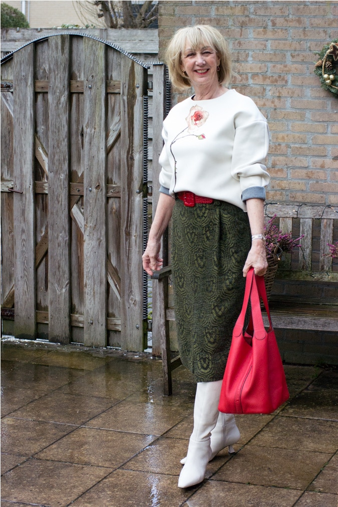 green midi skirt with a cream sweater