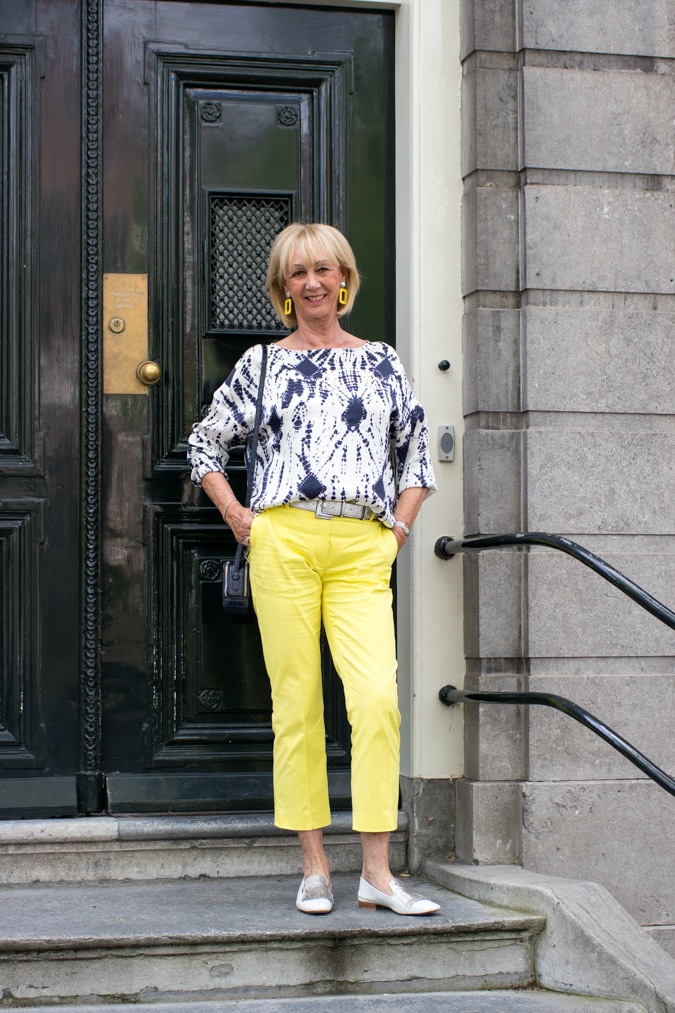 Blue and white top with yellow trousers in Amsterdam
