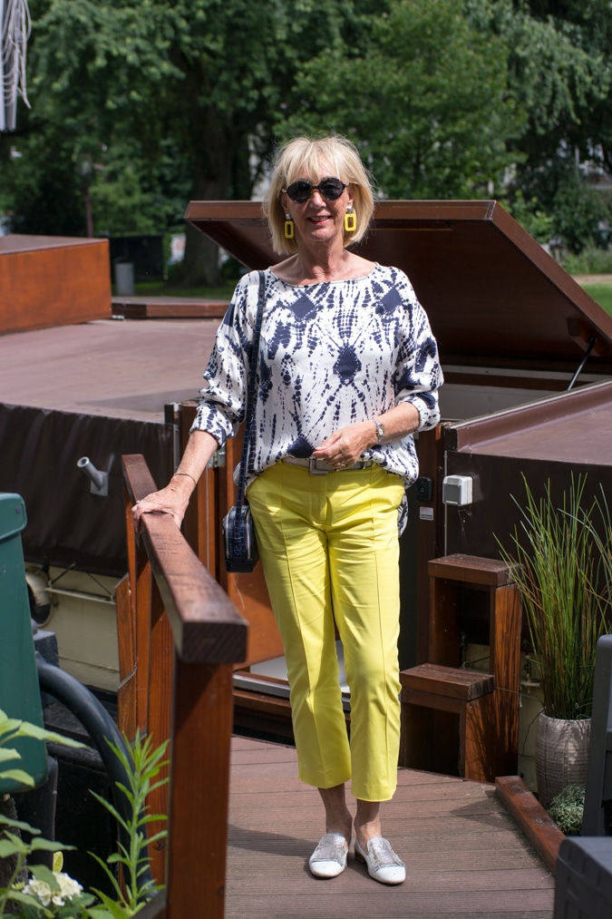 Blue and white top with yellow trousers