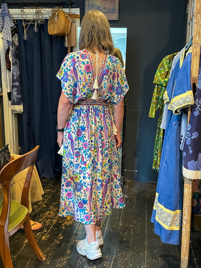Katrien trying on a dress at Lionheart Vintage in Leiden