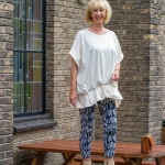 Cream top with artsy vibe and patterned trousers