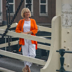 Orange jacket with white trousers