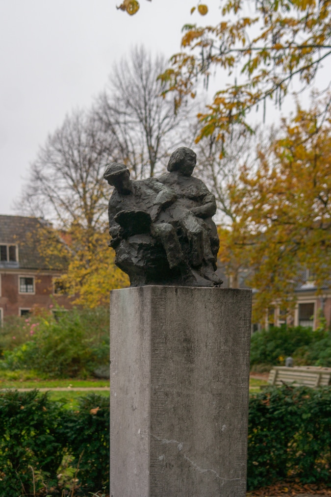 statue at almshouse court in Haarlem