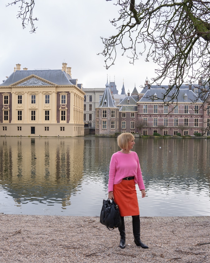Orange leather skirt with a pink jumper in The Hague