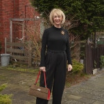 Wide black trousers with a black fitted top
