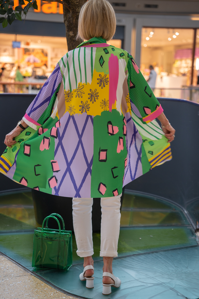 Colourful dress worn as a jacket