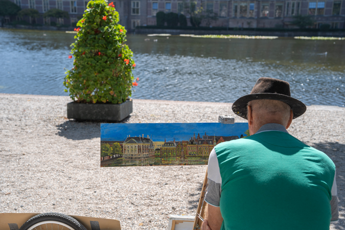 Street artist painting in The Hague