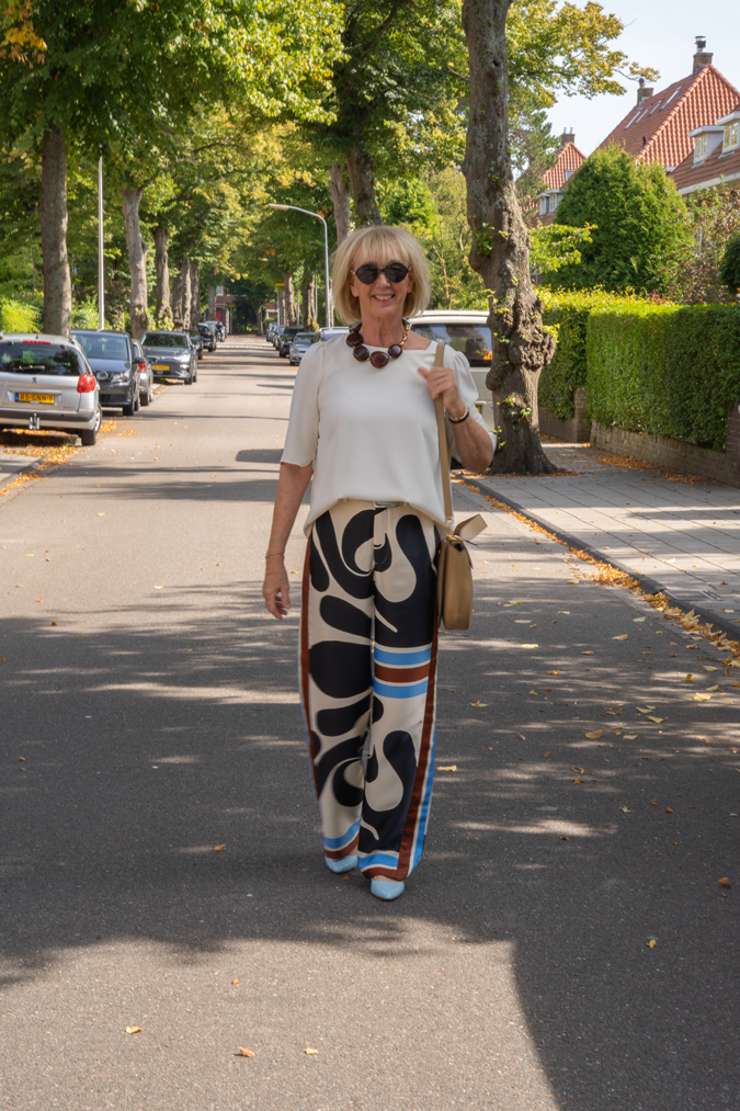 Arty print trousers with cream top