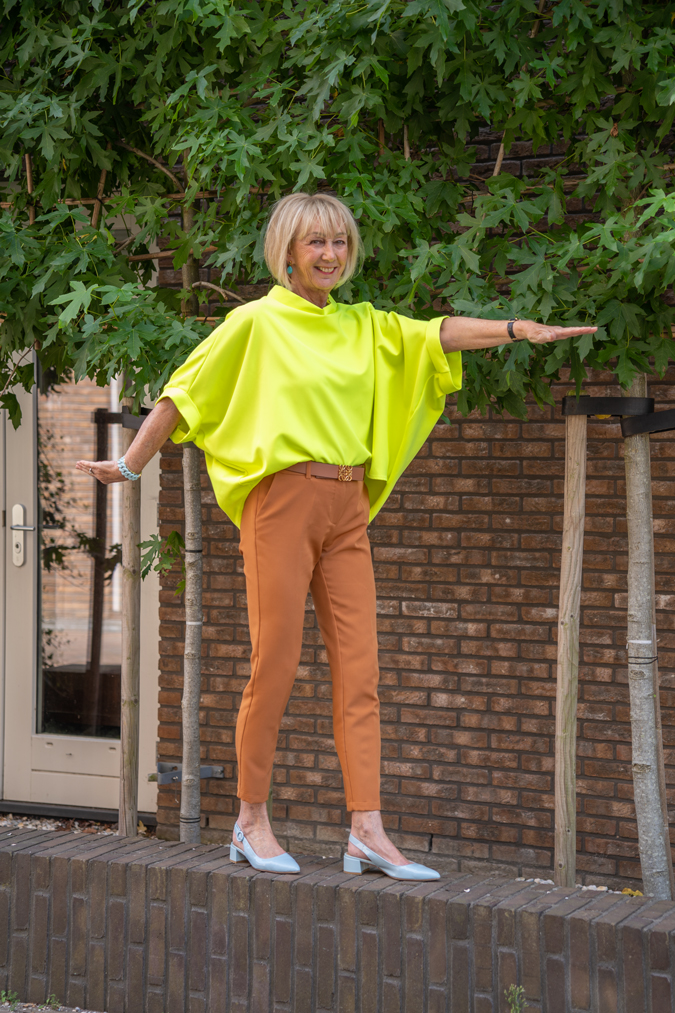 Neon yellow top with cognac coloured trousers