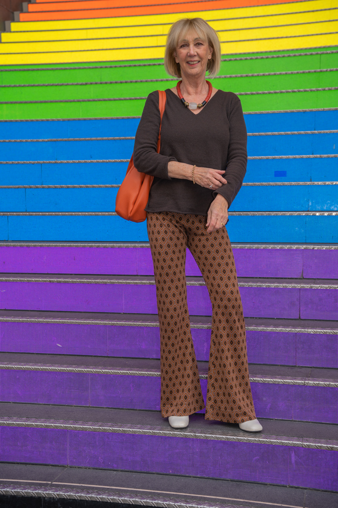Brown jumper with patterned trousers