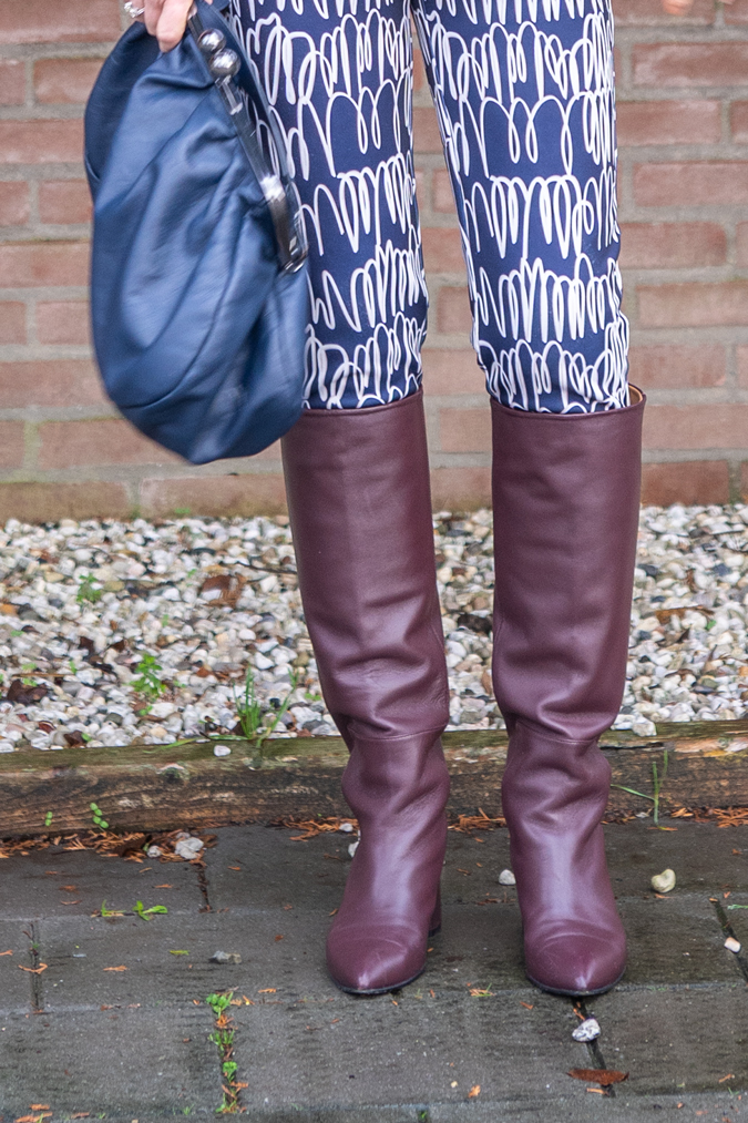 Patterned trousers and burgundy boots