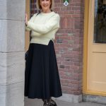 Wide black skirt with pale yellow jumper