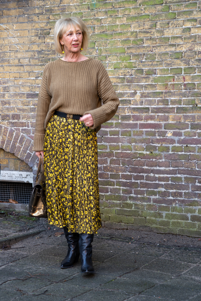 Yellow and black pleated skirt with olive coloured jumper