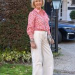 Wide cream trousers with a red and white shirt
