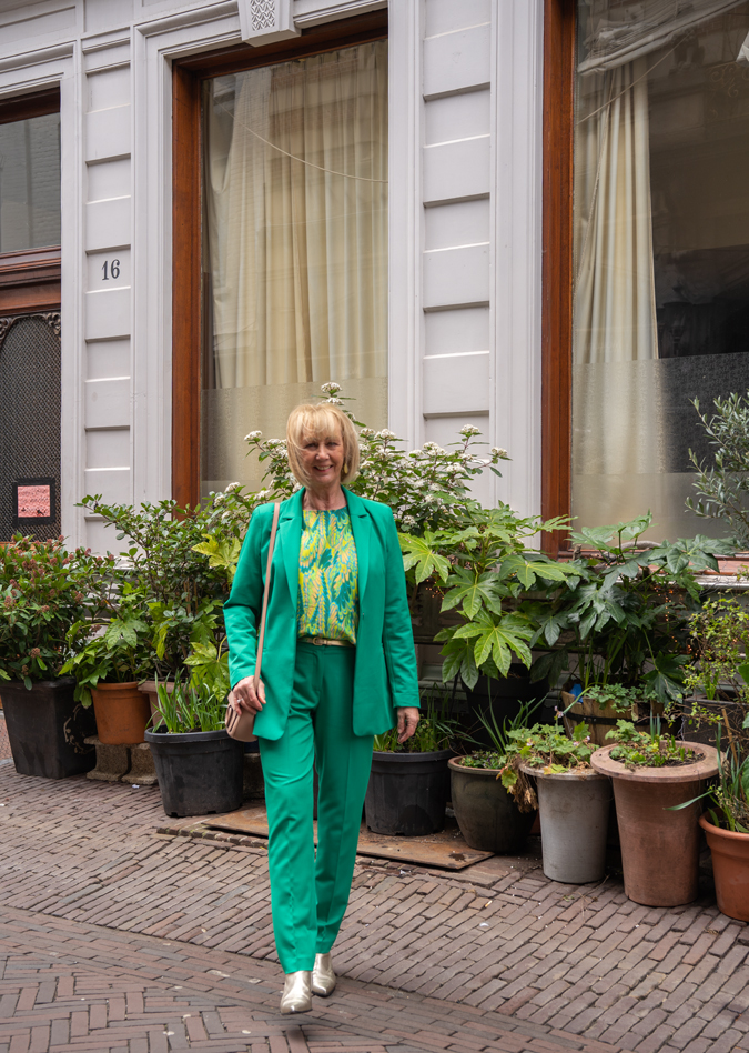 Green suit with green yellow blouse