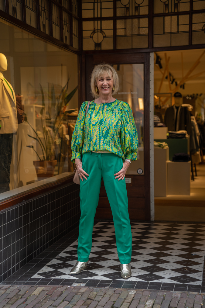Green suit with green yellow blouse