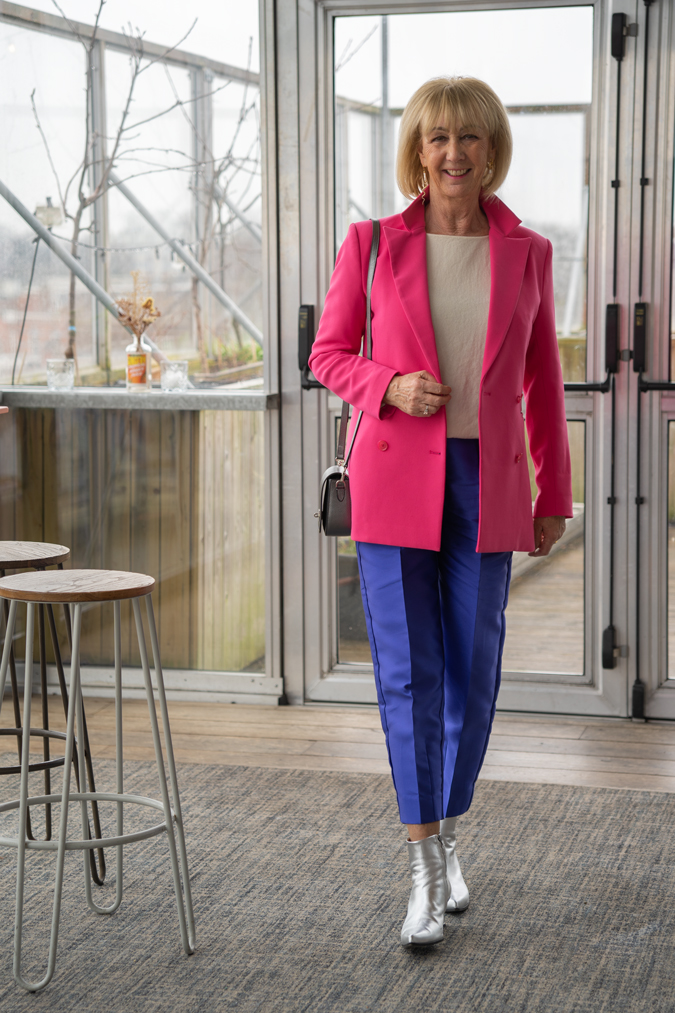 Purple blue cropped trousers with bright pink blazer