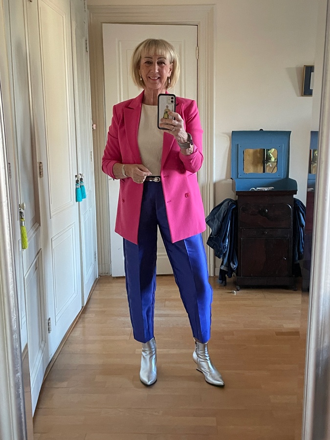 Bright outfit with bright pink blazer and purple blue trousers