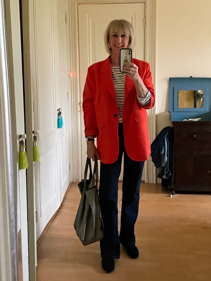 Oversized orange blazer with flared jeans