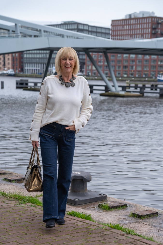Flared jeans with a cream jumper