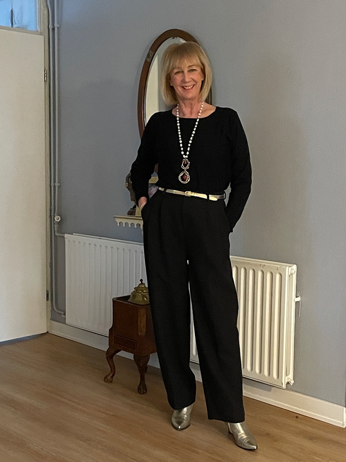 At Marianne's, wide black trousers with a black top.