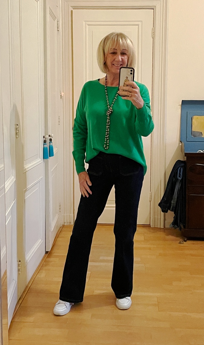 Green jumper with flared jeans