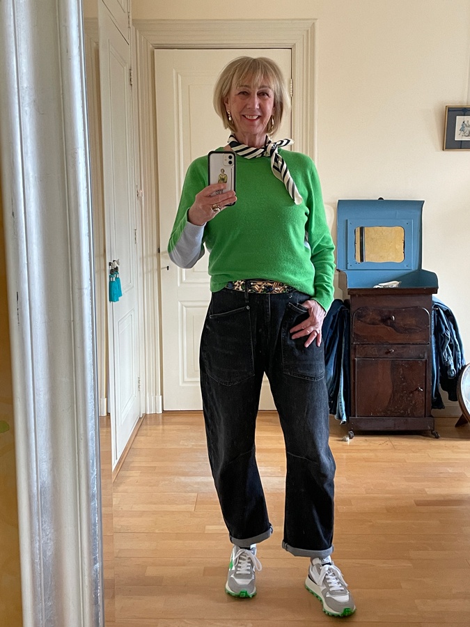 Man repeller jeans with a green and blue jumper