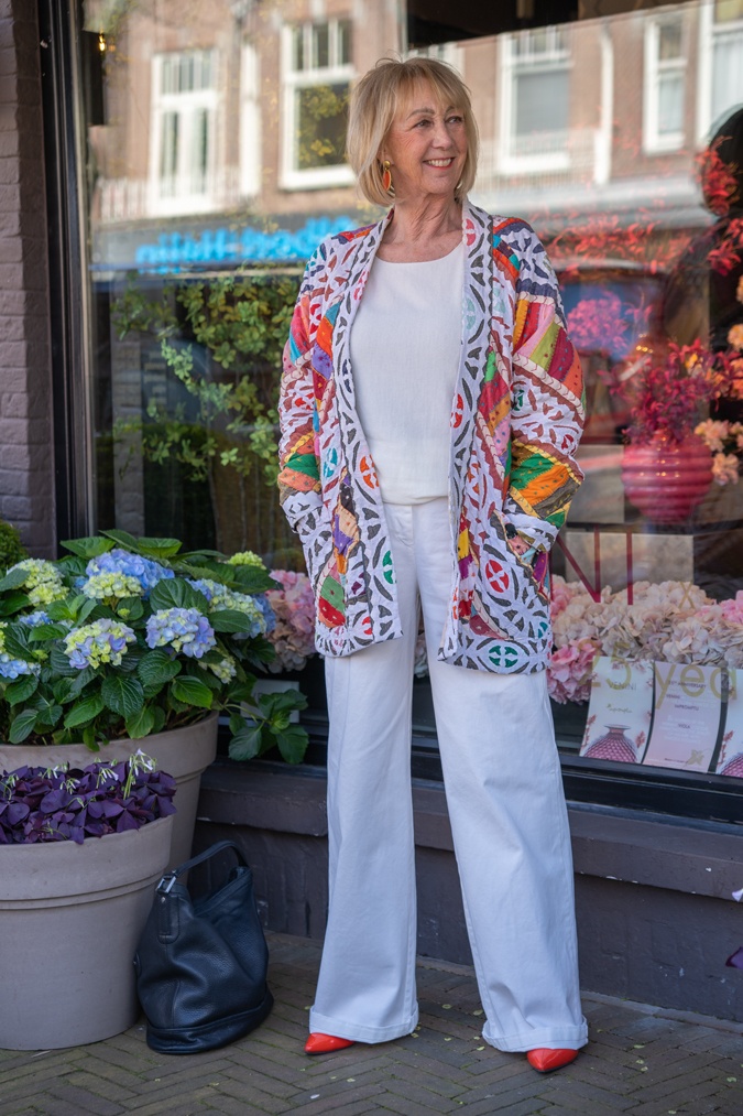 Multicoloured jacket with white wide leg trousers