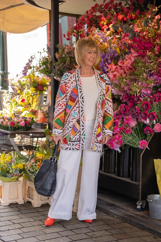 Multicoloured jacket with white wide leg trousers